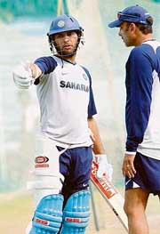 Yuvraj Singh (left) talks to Ravi Shastri during a net practice session in Dhaka on Tuesday. 
