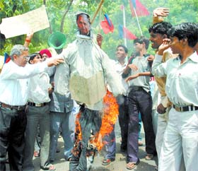 Activists of Bhartiya Kranti Party burning effigy of UP Chief Minister Mulayam Singh Yadav to protest against the police raj in Uttar Pradesh at Jantar Mantar in the Capital