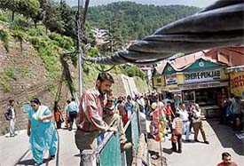 These electricity main wires passing through The Mall in Shimla are at a height of just 5 ft. at one point.