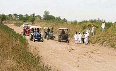The cleaning work of Budda Nullah in progress at Dhnansu village near Ludhiana on Wednesday