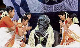 Women offer tributes to the statue of Rabindranath Tagore on the occasion of his 147th birth anniversary at Jorashanko in Kolkata on Wednesday.