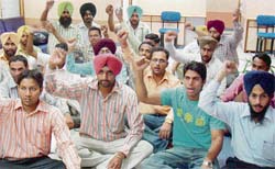 Members of the Computer Teachers’ Union, Punjab, raise slogans in the office of the director general of school education (DGSE), Sector 34, Chandigarh