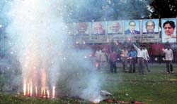 BSP supporters burst crackers at the partys New Delhi office on Friday to celebrate its victory in the Uttar Pradesh assembly poll.