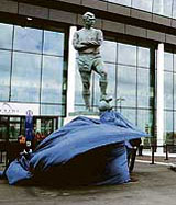 A statue of Englands 1966 World Cup football hero Bobby Moore being unveiled at the new Wembley Stadium in London on Friday.