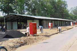 Workers give finishing touches to the sheds for secondhand booksellers in Sector 15-B, Chandigarh, on Saturday.