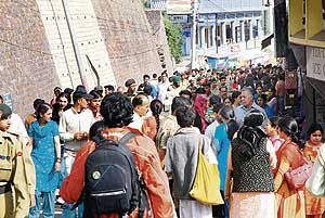 Tourists crowd The Mall in Shimla on Saturday.