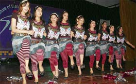 Students of a fashion technology institute present a dance number during the annual day function of the institute in Ludhiana