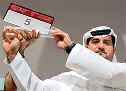 Emirati Talal Khouri holds up the most expensive car number plate in the world after purchasing the plate for Dirham 25.2 million ($6.86 million, Euro 5.07 million) at a special car number plate auction in Abu Dhabi on Saturday. The auction beat the previous world record by more than 10 times.