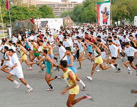 Runners take part in a 5-km race conducted as a precursor to the 4th Military World Games near the secretariat in Chandigarh.