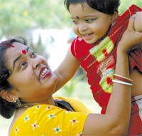 Dont forget me: A woman reminds her child on Mother's Day in the Capital on Sunday. 