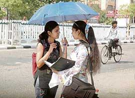 Girls in the middle of an animated discussion on a hot summers day