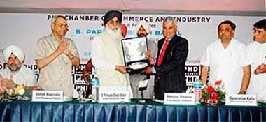 Chief Minister Parkash Singh Badal being presented a memento by the PHD Chamber of Commerce and Industry in Ludhiana