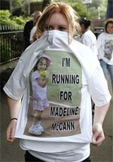A runner shows off her designed T-shirt specially printed with a picture of Madeleine McCann at the start of the Resolution womens run in Glasgow, Scotland, on Sunday. Hundreds of T-shirts were handed out to runners by Madeleine's aunt Diane, who took part in the race, with the help of friends and family. Celebrities and business leaders have put up a @@ 1.5 million reward, bringing the total to  2.6 million to help find Madeleine McCann, the four-year-old who disappeared from a Portuguese holiday resort 10 days ago