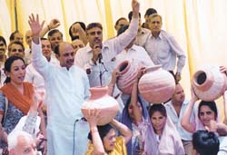 BJP activists stage a dharna to protest against water scarcity at the Jal Board office in Mukherjee Nagar in the Capital