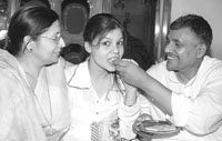 Ruchika Jain along with her parents.