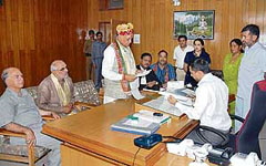 Former Chief Minister and BJP candidate Prem Kumar Dhumal files his nomination papers for the Hamirpur lok Sabha byelection on Monday.