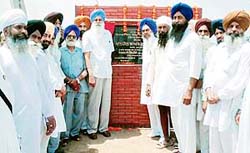 Chairman of the Punjab Mandi Board Ajmer Singh Lakhowal inaugurates the project for the widening of a link road in Samrala