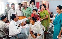 Doctors from Christian Medical College and Hospital examine patients at a free eye check-up camp organised by the Bhartiya Social Welfare Society in Ludhiana