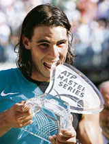 Spains Rafael Nadal holds the ATP trophy after winning the Rome Masters tennis tournament on Sunday. Nadal beat Chiles Fernando Gonzalez 6-2, 6-2 in the final. This was his 77th consecutive victory on clay.