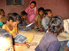 Children of labourers employed at brick-kilns attend a bhattashala at Jaisinghpura village in Jhajjar district.