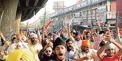 Activists of the Sikh Students Federation stage a dharna on the Ferozepur Road, near the mini secretariat, in Ludhian