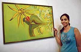 City-based artist Surpreet Manocha with her painting at Government Museum and Art Gallery, Sector 10, in Chandigarh on Tuesday.