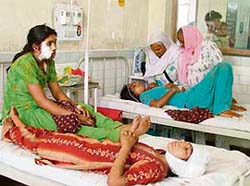The injured daughters (both on one bed) and their mother Manjit Kaur (on the second bed) of Bonker Dogra village, who were injured and looted by a gang of robbers.