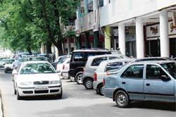Cars parked in the parking lot opposite the Mehfil restaurant in Sector 17, Chandigarh