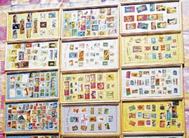 Piara Singh shows his coin and stamp collection.