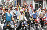 Youths take out a protest march on motor cycles in Ambala on Friday.