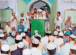 The Shahi Imam of the Jama Majid along with other devotees holds a prayer in Ludhiana for peace in the state