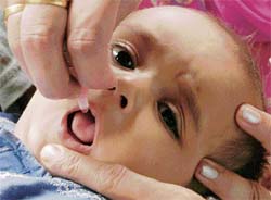 A child being administered polio drops at a booth in Chandigarh on Sunday