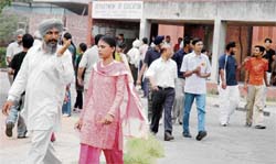 CET candidates come out of an examination hall during break on the PU campus 