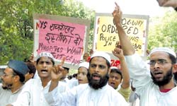 Members of the All India Minorities Front hold a demonstration in the Capital on Sunday to register their protest against the police attacks on members of minority
