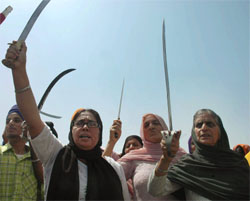 Sikh women hold a demonstration against Dera Sacha Sauda chief in Jammu on Sunday.