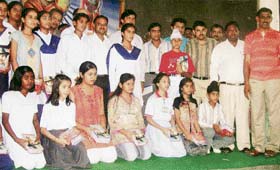 Toppers of board classes of various schools pose after a felicitation function at Mandi Ahmedgarh