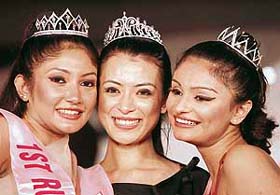 Winners of 'Sananda Tilottama 2007' beauty contest  Karishma Pradhan (centre), first runner-up Debjanee Chakrabarty (left) and second runner-up Dimpy Ganguly, strike a pretty pose in Kolkata