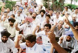 BSNL employees protest outside their office in Sector 34, Chandigarh