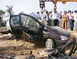 The crushed remains of a car that collided with a railway engine in Jhane village, near Ludhiana,