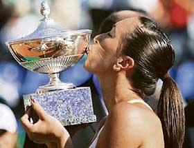 Serbias Jelena Jankovic kisses the trophy after beating Russias Svetlana Kuznetsova in the final of the Rome Masters tennis tournament on Sunday. Jankovic won 7-5, 6-1. 