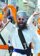 Sikh activists protest against Dera Sacha Sauda chief Baba Gurmit Ram Rahim Singh during the bandh, in Amritsar on Tuesday. 