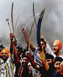 Sikh youths with swords in hands raise slogans during the bandh in Jammu on Tuesday.