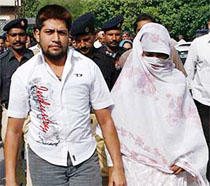 Shumail Raj (left) and his wife Shezina Tariq arrive at the Lahore High Court on Tuesday. A Pakistani court sent the couple to jail on the ground that the husband was actually a woman and that same-sex marriages were against Islam.