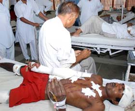 Sikander, who was thrown out of a running train, receiving treatment at the civil hospital, Karnal