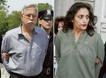 Mahender Murlidhar Sabhnani of Long Island, New York, is led out of Nassau County police headquarters in Mineola after his arrest on forced labour charges on Tuesday. Sabhnani (51) and his wife, Varsha Mahender Sabhnani (right) who operate a worldwide perfume business are accused of keeping two Indonesian women as slaves in their luxurious Long Island home and abusing them for years. 
