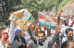 Jubilant Congress supporters celebrate the party victory in the MC elections in Shimla on Friday.