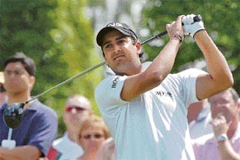 Shiv Kapur watches his tee shot as he starts his 2nd round of the BMW PGA Championship at the Wentworth Golf Club in Surrey, south-east England, on Friday. 