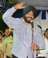 BJP MP Navjot Singh Sidhu addresses a rally at Nadaun on Saturday.