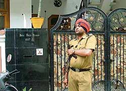 A policeman stands guard outside the house of SGPC chief Avtar Singh Makkar in Ludhiana