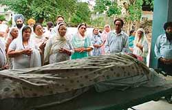 Mourners at the funeral of the industrialist and wife who allegedly committed suicide in Ludhiana